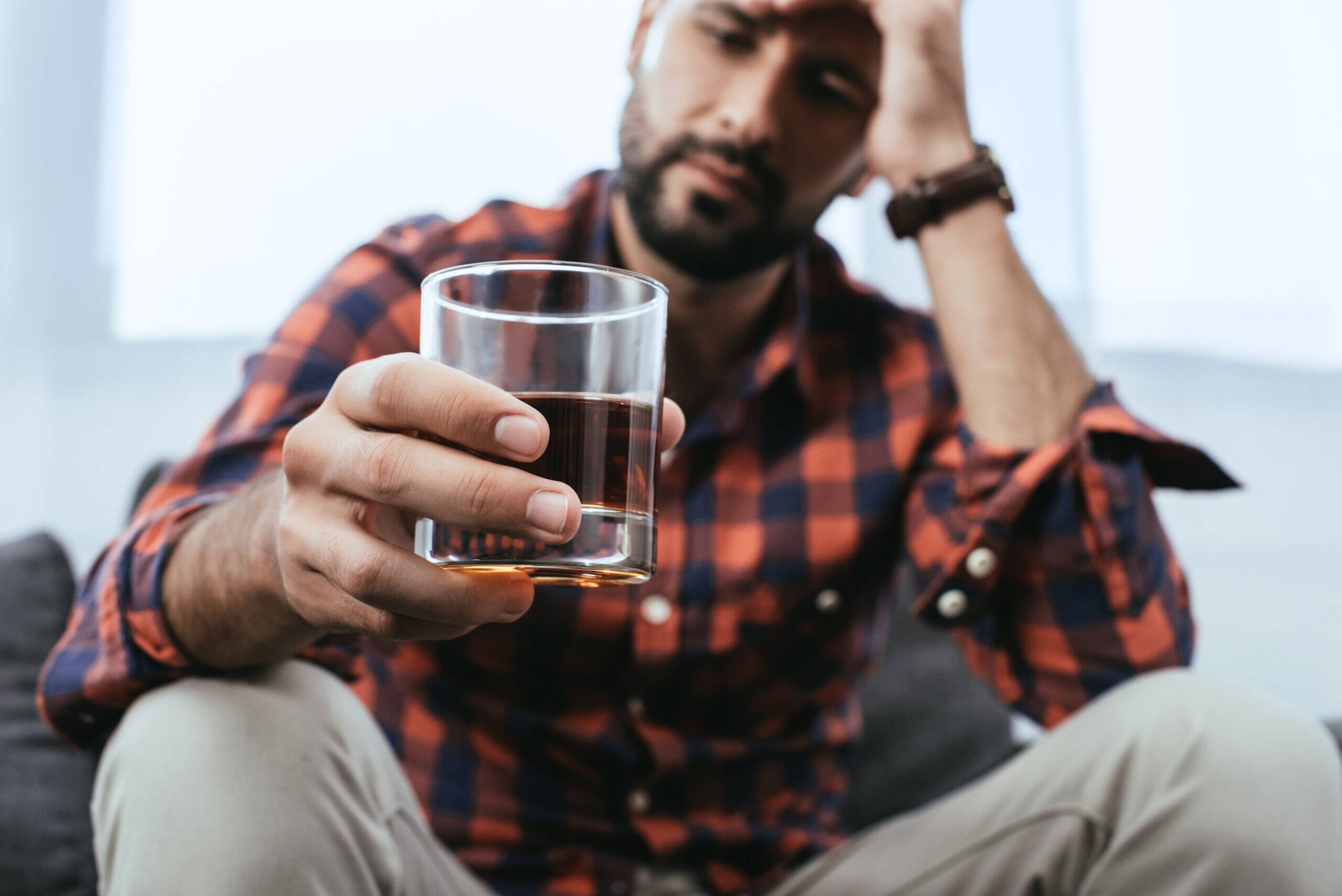 man experiencing the effects of drug and alcohol abuse on the digestive system