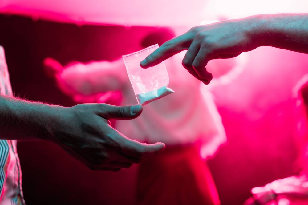 young adults taking acid LSD at rave party, psychedelic drug abuse and detox