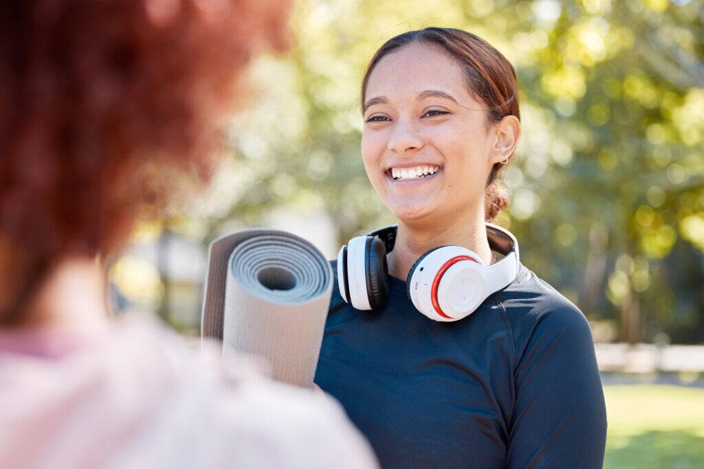 woman smiling and practicing prevention strategies and healthy lifestyle changes reducing breast cancer risks