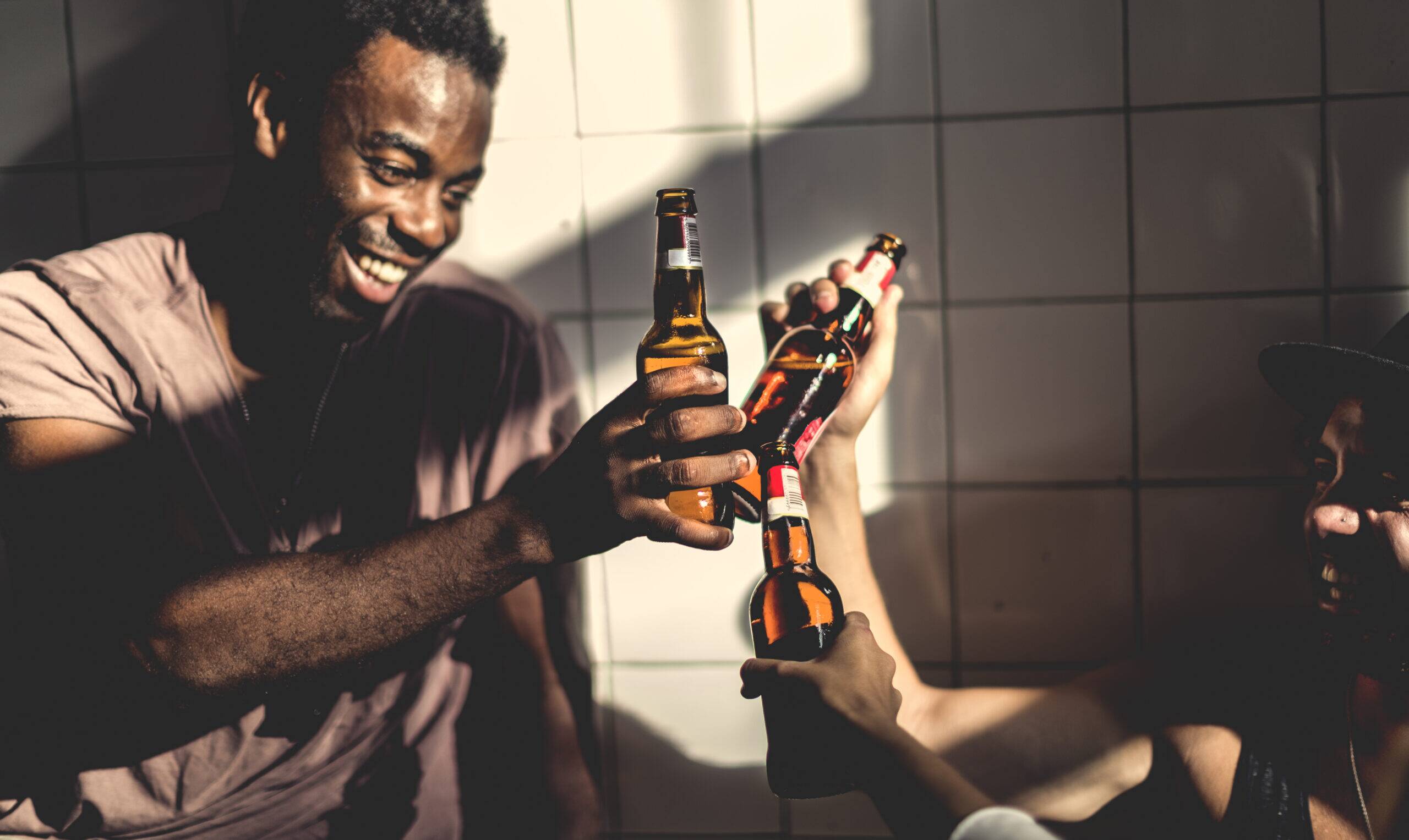 man drinking alcohol for courage and confidence in social settings, alcohol as liquid courage