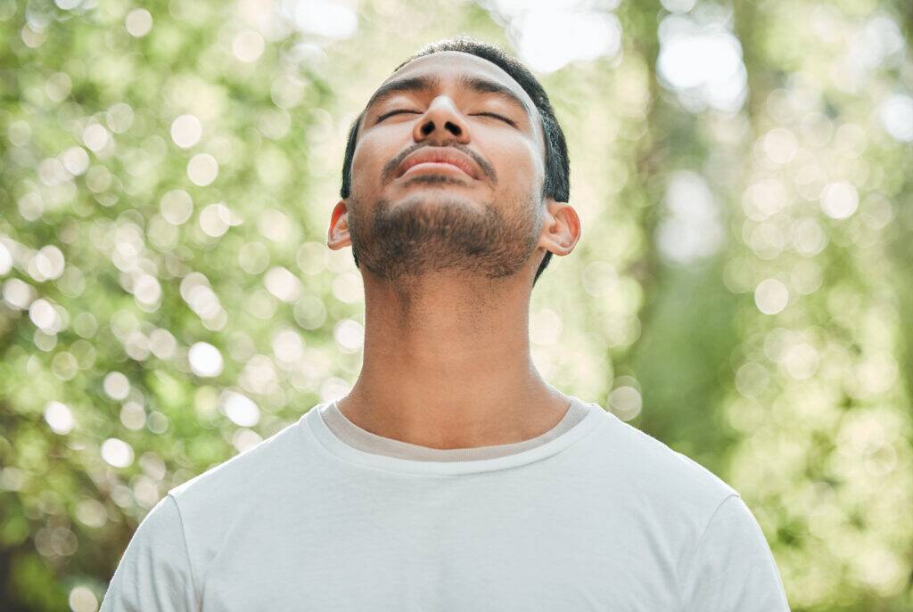 man practicing stress reduction techniques for managing stress levels, health self-medication and coping techniques