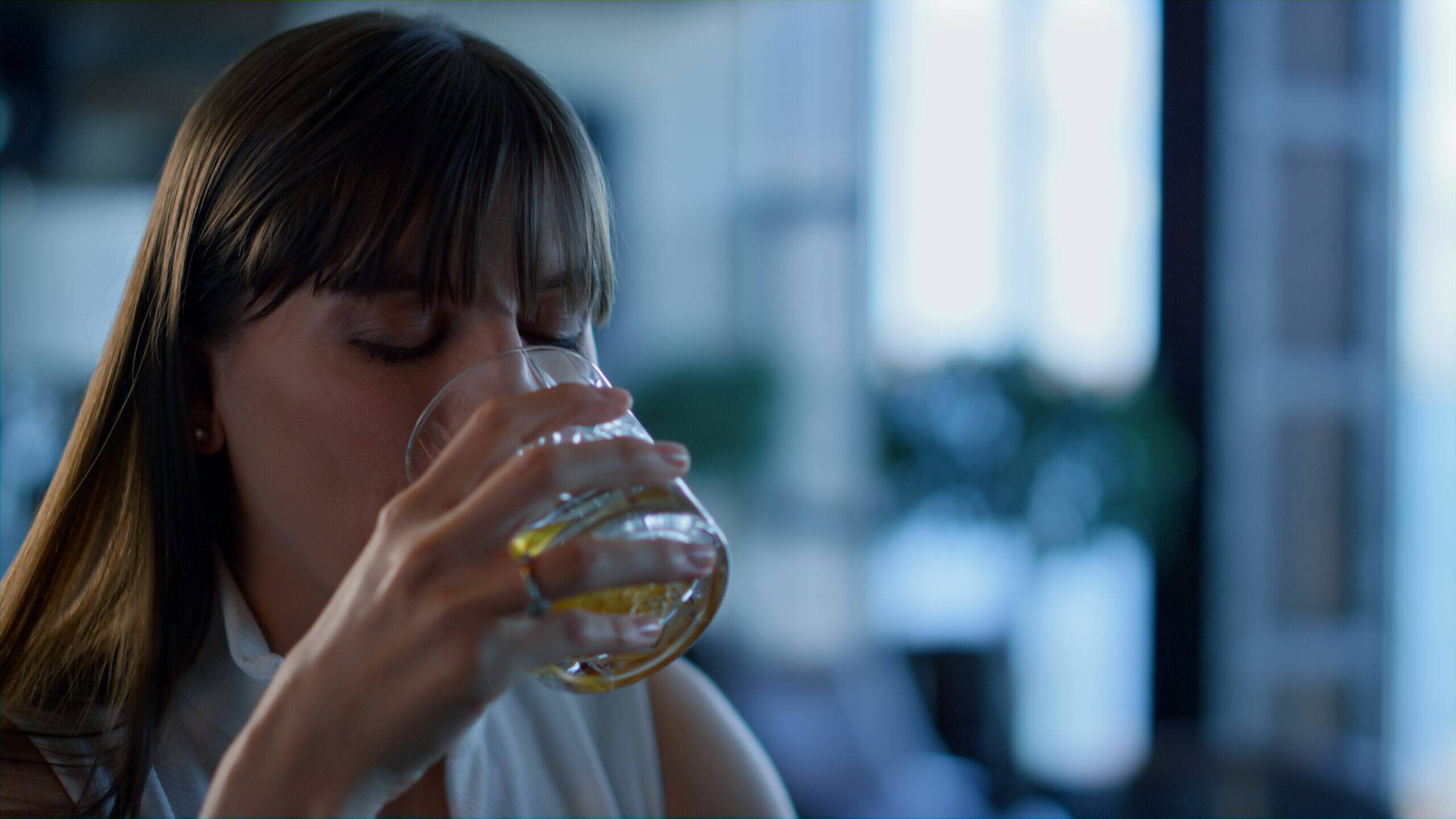 woman self-medicating stress with alcohol use