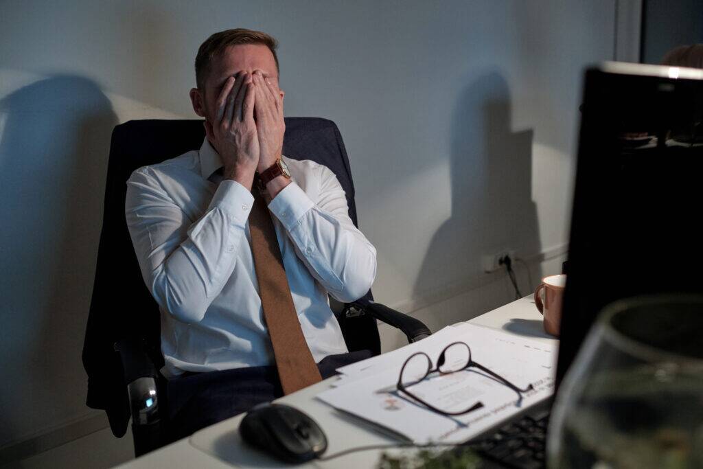 stressed out businessman wanting to self medicate for stress