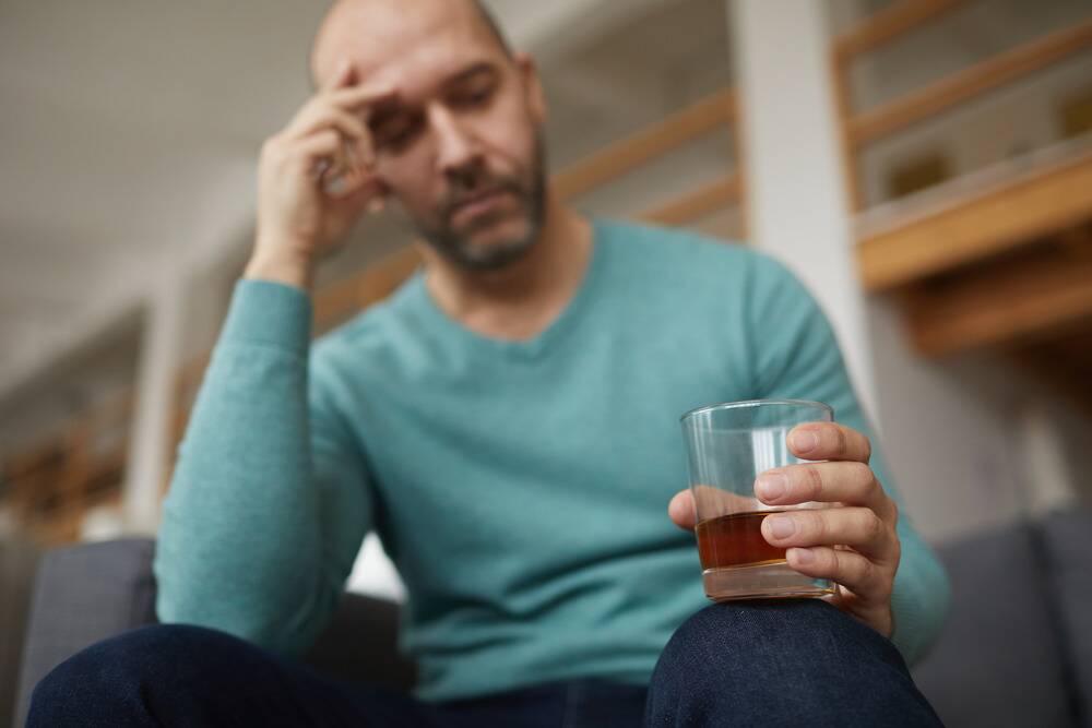 man struggling with substance abuse and memory loss, cognitive impairments from drug and alcohol abuse